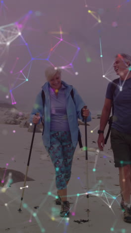 una pareja de ancianos caucásicos haciendo senderismo en el campo, a través de una colorida red de conexiones móviles.