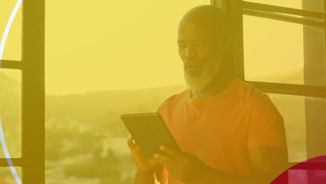 animation of shapes over senior african american man using tablet