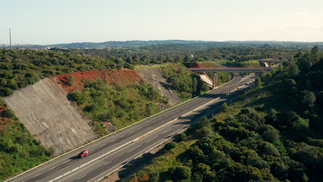 aerial: a highway going through the country side of the algarve in portugal