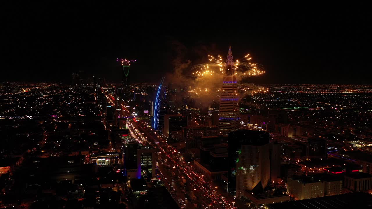 Aerial shot of fireworks from Al Faisaliyah Tower and other towers,  Riyadh, Saudi Arabia