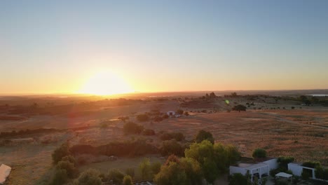 sunrise sunset aerial over farmland agriculture farm field, start of day rural portugal