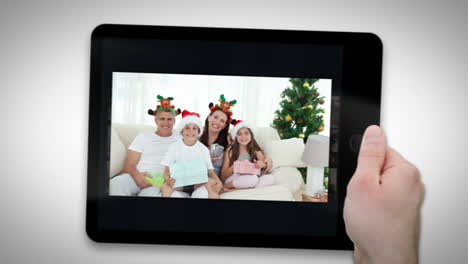 animated tablet computer displaying videos about family celebrating