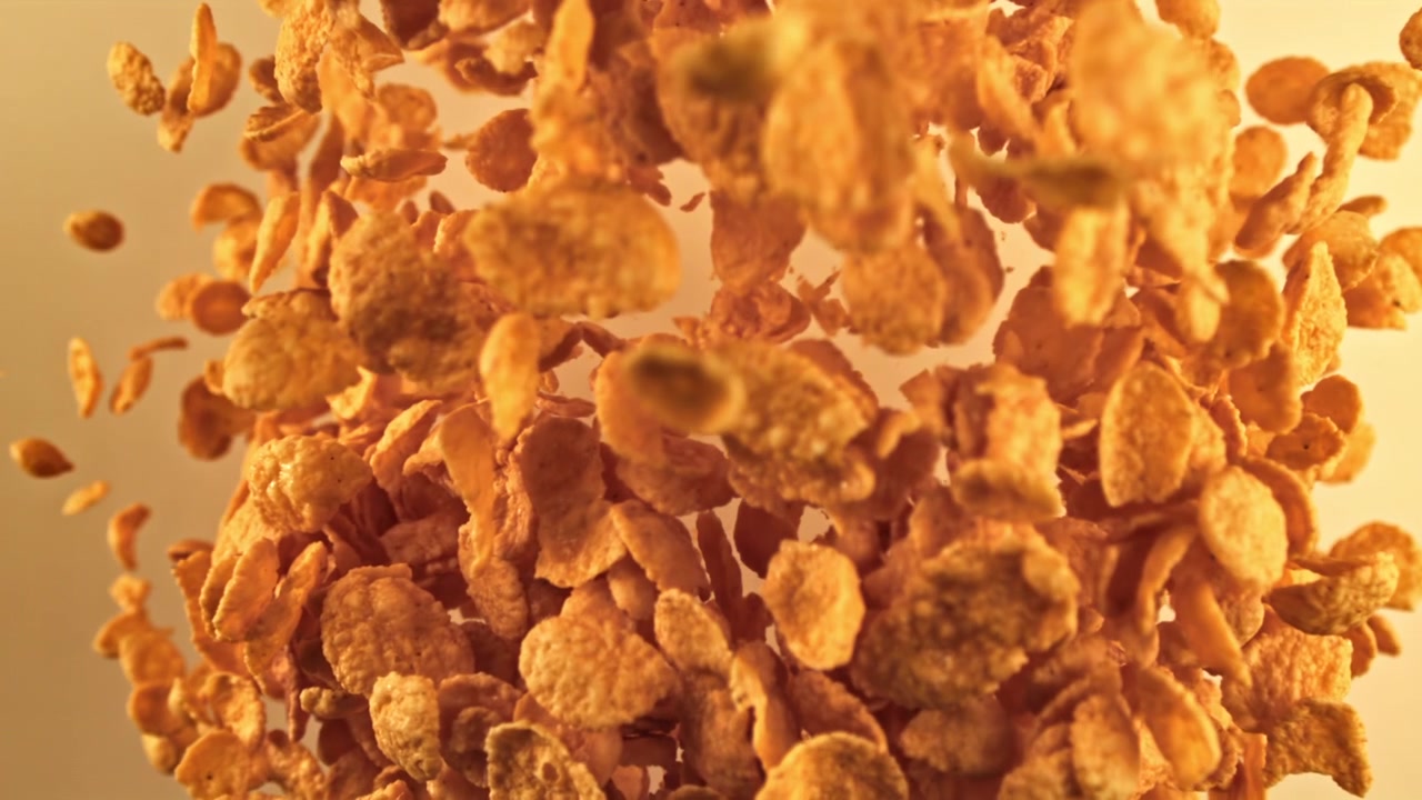 Golden Cornflakes Falling in Slow Motion