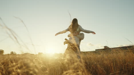 happy couple dancing at sunset during valentine's day