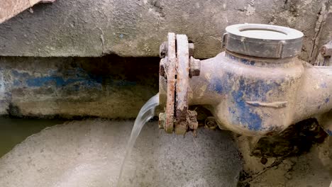 dirty water flows from the water meter pipe