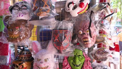 halloween horror theme costumes and villain masks are seen for sale to the public at a stall days before halloween in hong kong