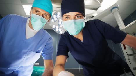 doctors checking patient at operating room