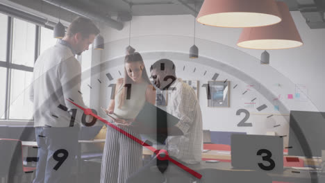 animation of ticking clock against three diverse colleagues discussing together at office