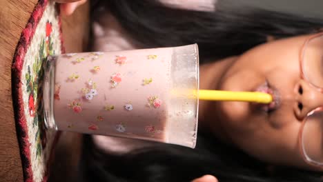 girl drinking a smoothie