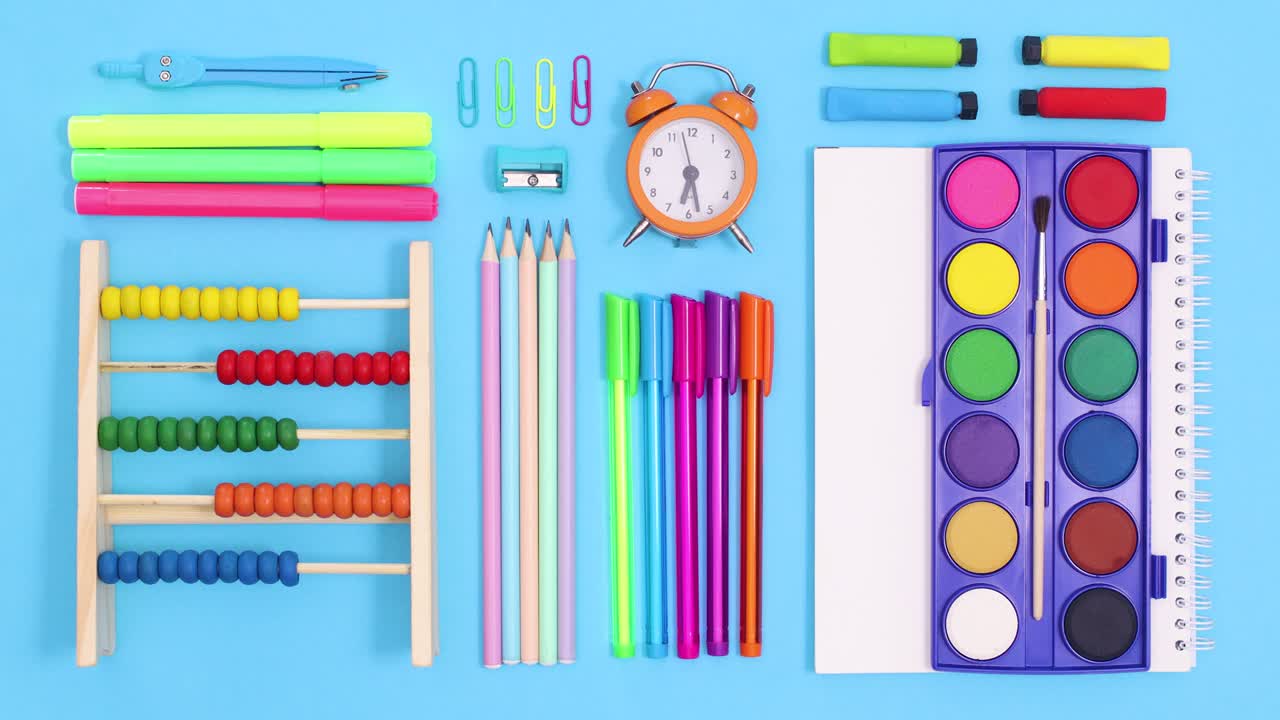 Back to school tools appear and make creative layout on blue theme. Stop motion