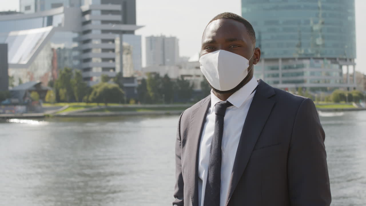 Black Businessman Wearing Face Mask Outside