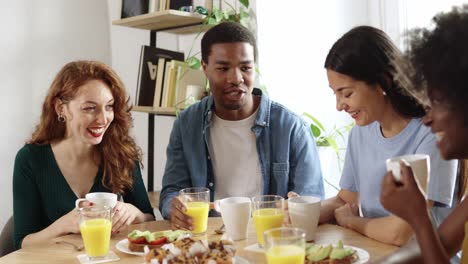 Group of friends having breakfast