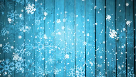 animación de nieve cayendo sobre un fondo de madera azul con espacio de copia en navidad