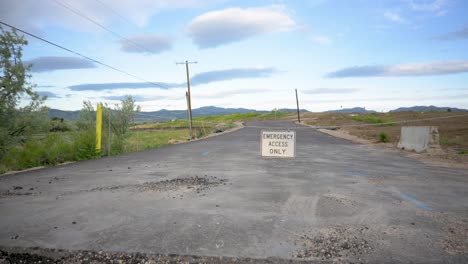 road closed leading to new housing construction in the mountains, pan