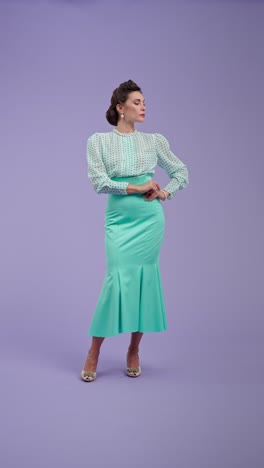 woman in retro fashion posing against purple background