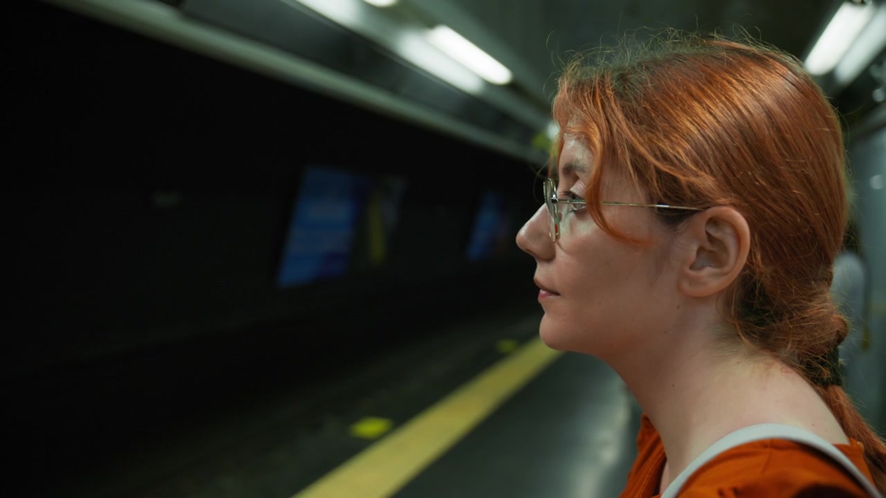 A female tourist waits for the Naples metro on the arrivals platform
