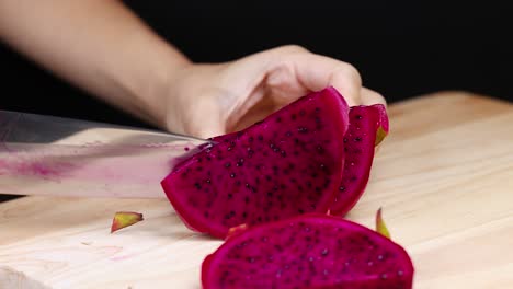 cutting a dragon fruit into slices