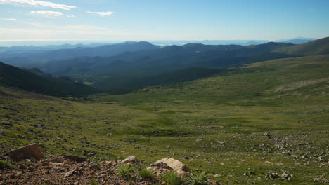 Cinematic-late-morning-view-Denver-Mount-Evans-snow-Summit-Echo-Chicago-lakes-14er-front-range-foothills-Rocky-Mountains-Idaho-Springs-Evergreen-slow-motion-wide-scenic-landscape-pan-to-the-right