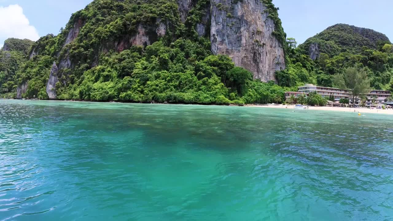 Revealing Phi Phi island coast approaching with a speed boat on it's beach