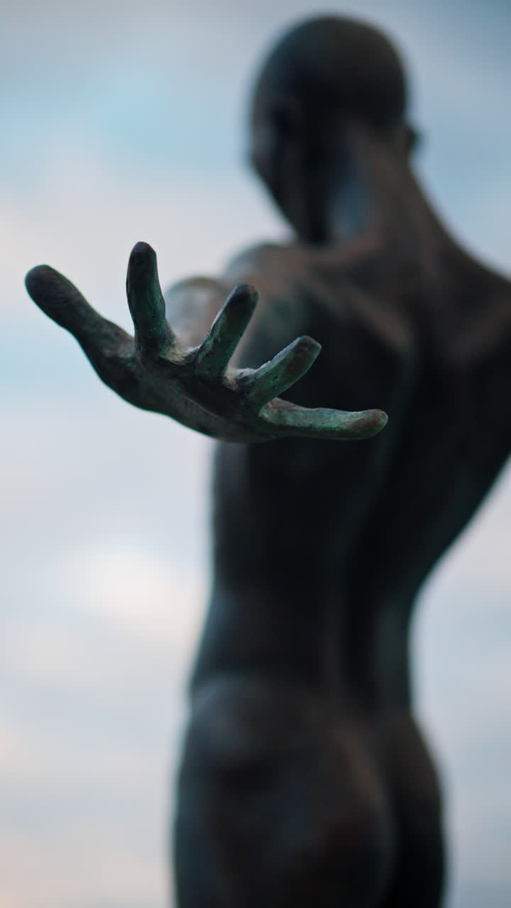 Antibes, France - October 14, 2024: Close up of the bronze sculpture Grand Defi by Nicolas Lavarenne. Vertical