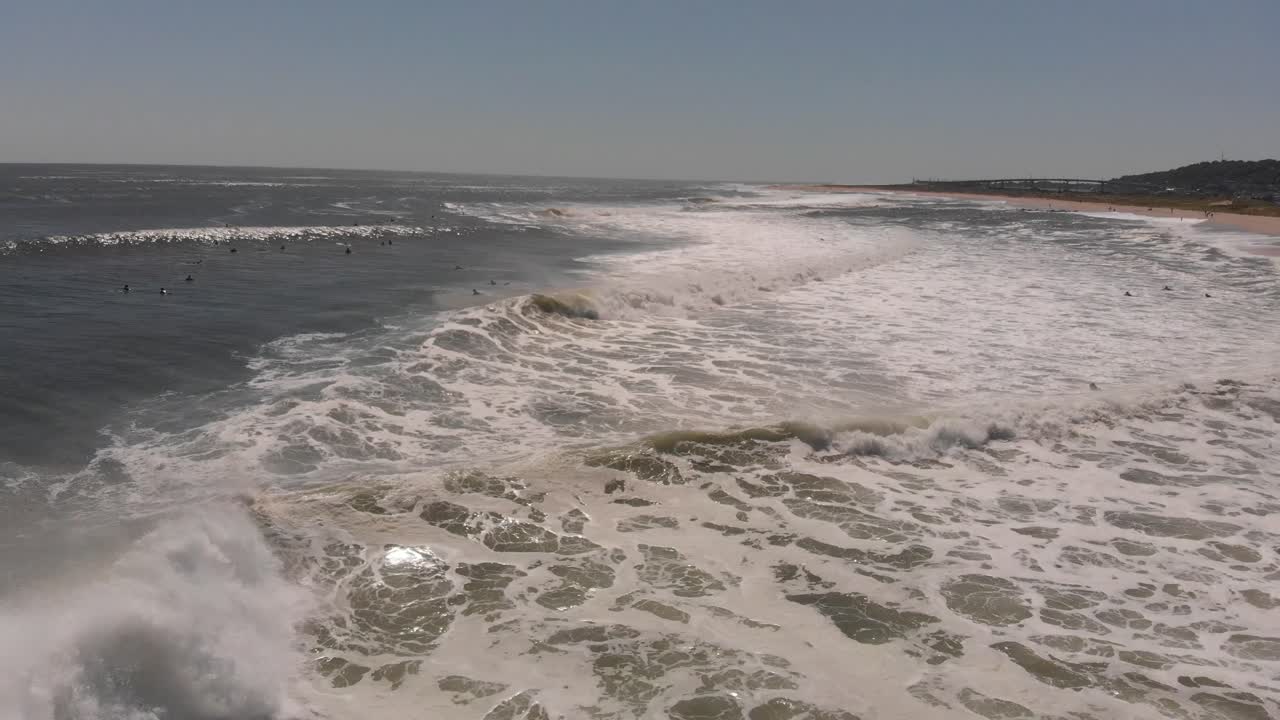 Surfers In The Lineup Of Breaking Waves, editorial