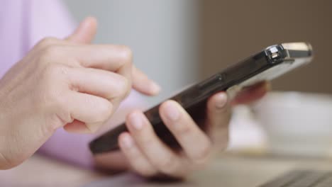 a young businessman is taking a video conference and touchscreen with customers via a smart phone connected to the internet.