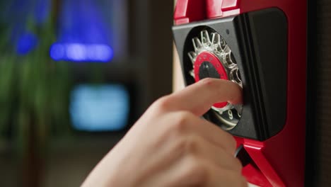 retro vintage phone, red rotary telephone is displayed on a wooden desk, adding a nostalgic touch
