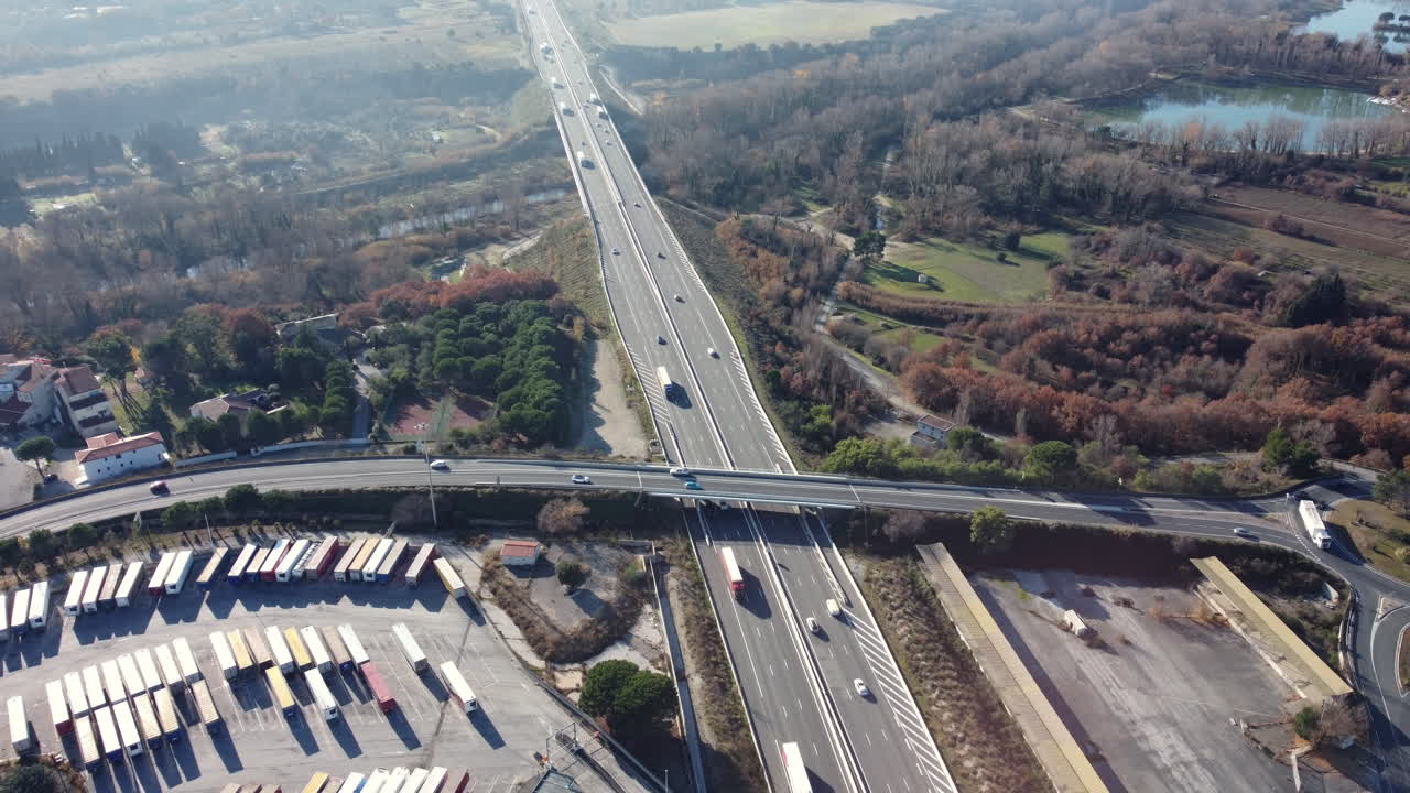 Highway Interchange with Truck Parking and Surrounding Landscape