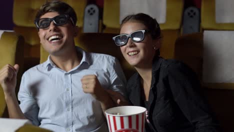 man and woman in the cinema watching a 3d movie