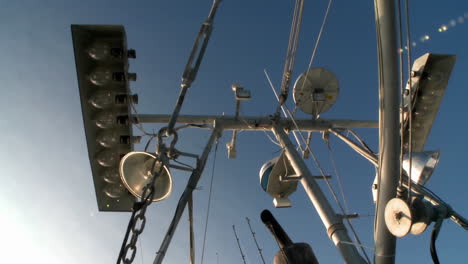 skyward view of a fish cutters mast with equipment