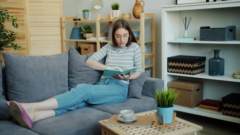 woman relaxing and reading at home