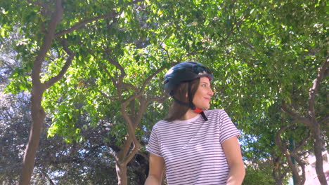 happy girl riding electric scooter in the city on a sunny day