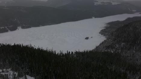 Flying-Above-Icy-Lake-At-Mont-du-Lac-a-L'Empeche,-Quebec-Canada