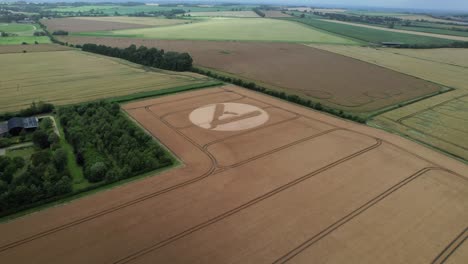 High-angle-view-approaching-cut-throat-razor-crop-circle-pattern-aerial-view-in-Hackpen-hill,-Swindon,-2023