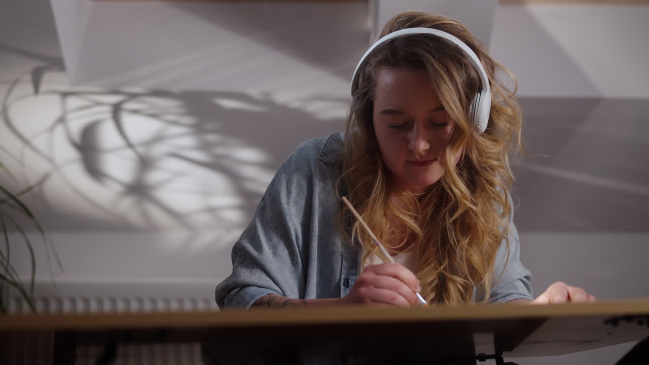 Woman Painting with Headphones