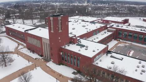 School-building,-winter-snowstorm,-flurries