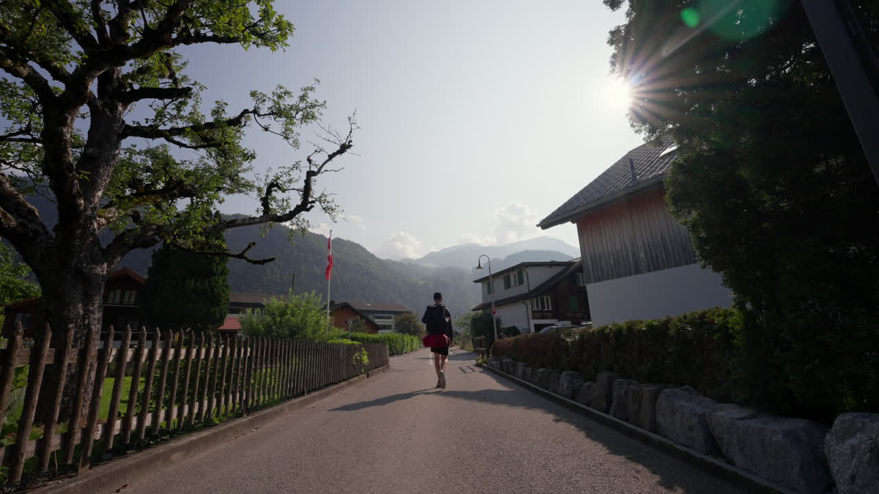 Swiss Village Street Scene with Hikers