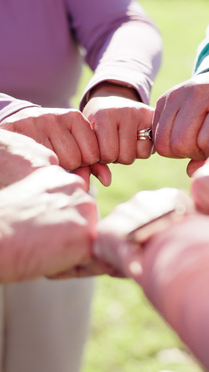 Group of People Showing Unity with Fists Together