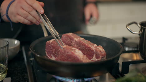 cooking steak in a pan