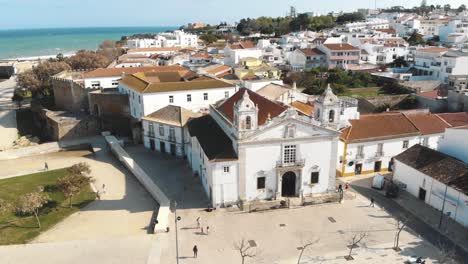 4k-drone-footage-of-the-Igreja-De-Santo-Antonio-church-of-the-seaside-town-of-Lagos,-Portugal