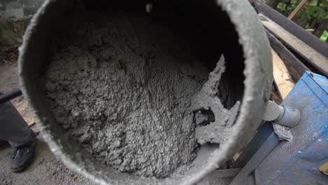 small cement mixer mixing concrete