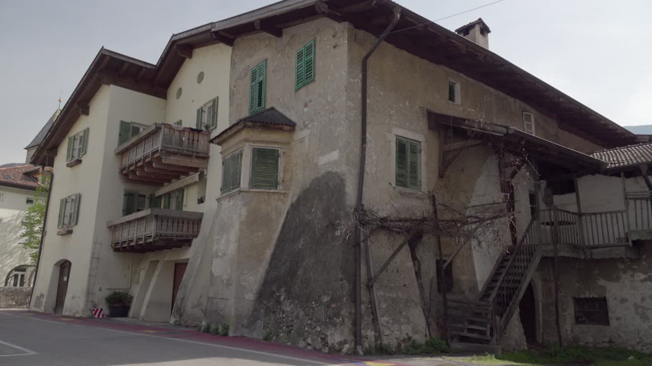 An originally old residential building with a new house added on in Kurtinig - Cortina, South Tyrol, Italy