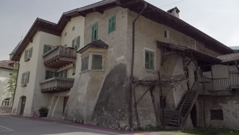 an originally old residential building with a new house added on in kurtinig - cortina, south tyrol, italy