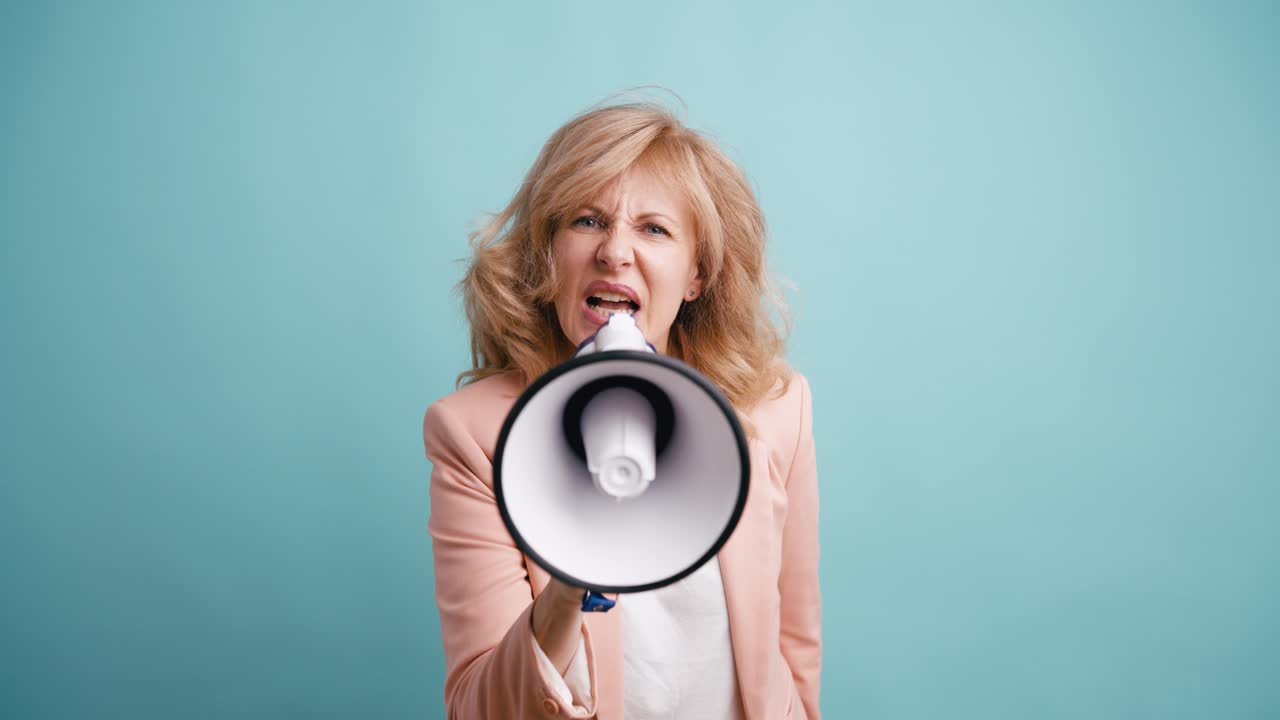 Angry Woman Shouting into Megaphone on Blue Background