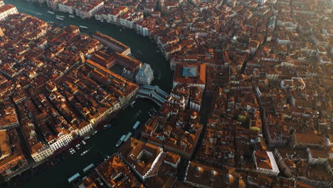 venice and its grand canal at sunrise in italy - aerial drone shot