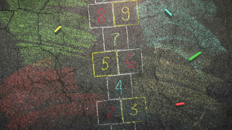Closeup colorful chalk on blackboard school background 1