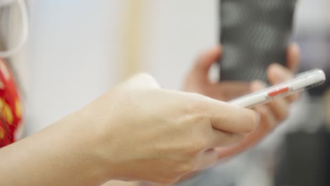 a young businessman is taking a video conference with customers via a smart phone connected to the internet.