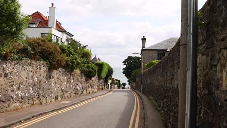 vehicles navigating a narrow street in aberdour