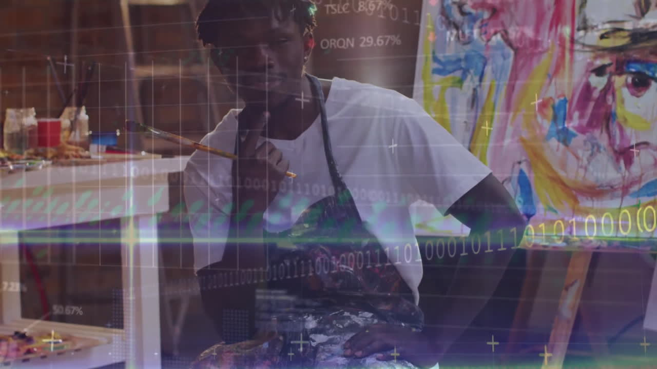 Animation of data processing over happy african american male artist smiling at paining studio