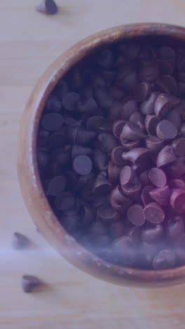 animation of light over chocolate crisps in bowl